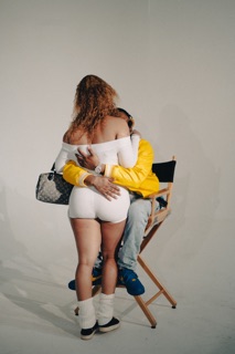 Two people embracing on set